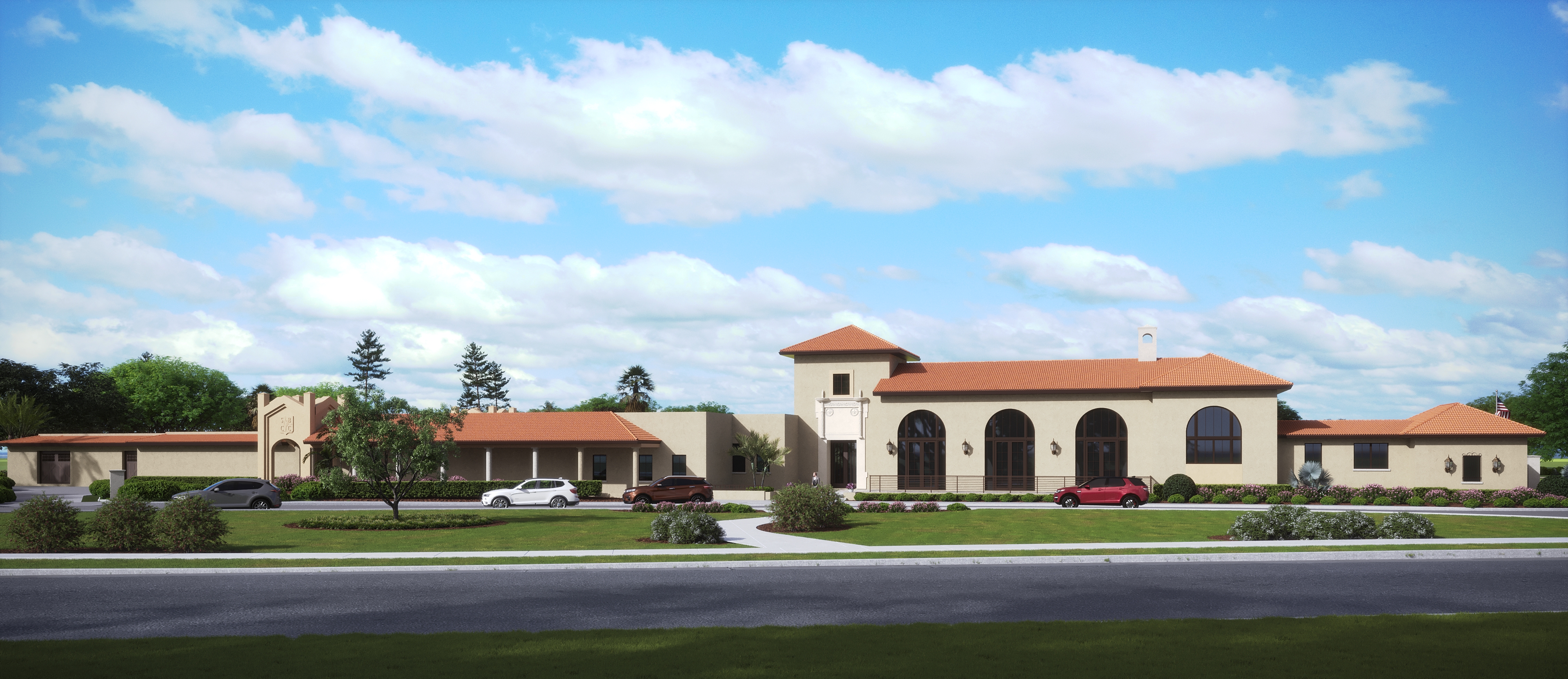 Front elevation of the renovated golf clubhouse showcasing arched colonnades, stucco façade, and tower element — modernized by CMSA Architects, a Sarasota architecture firm.