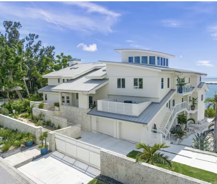 Luxury Sarasota waterfront residence with multi-level design and panoramic Gulf views in Lido Shores neighborhood.