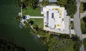 Aerial view of home in Sarasota showing modern coastal architecture and bayfront setting by CMSA Architects.