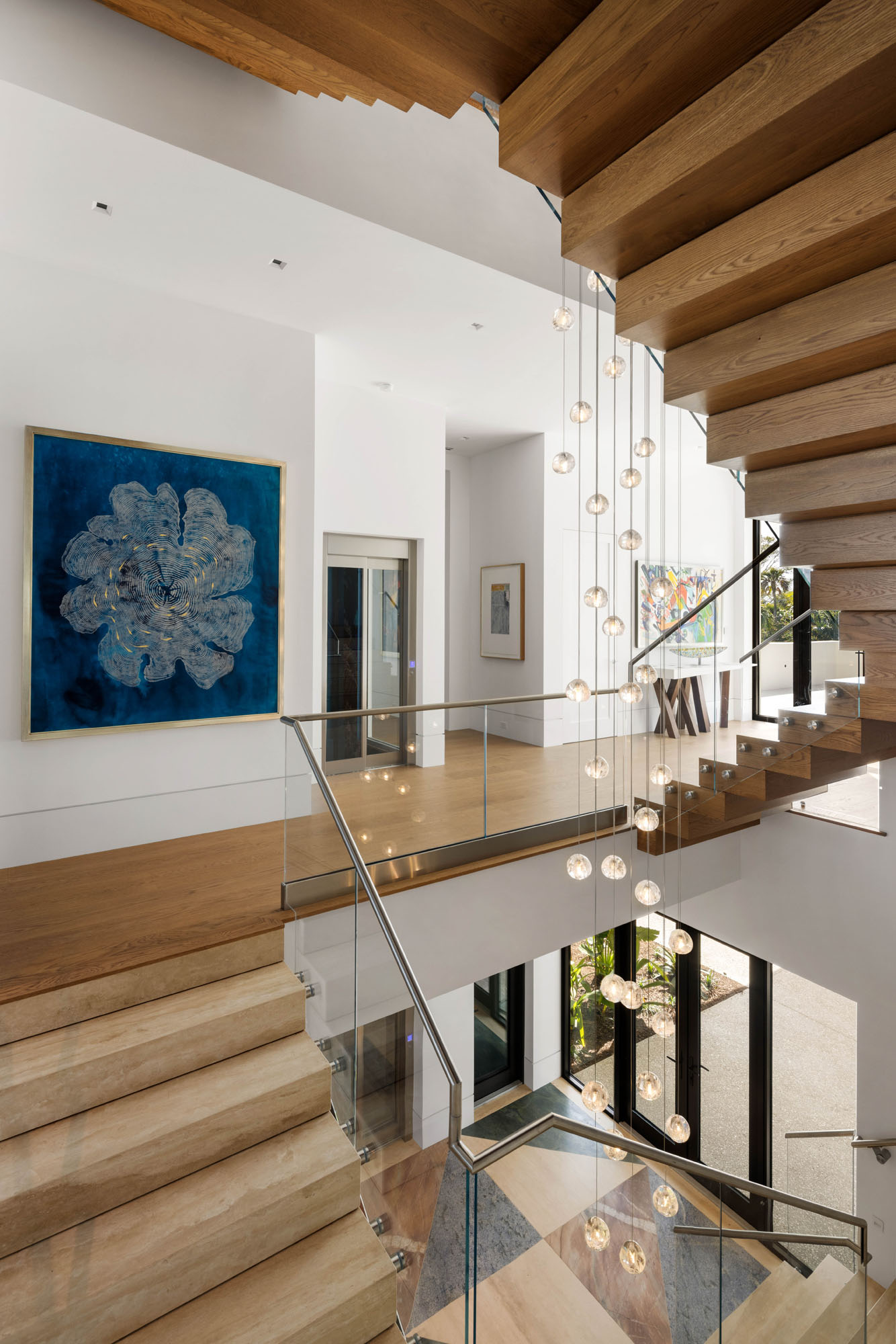 023_Norsota_Trinity_CMSA_RyanGammaPhotography_1 Interior stair with wood treads and glass railing in contemporary coastal home