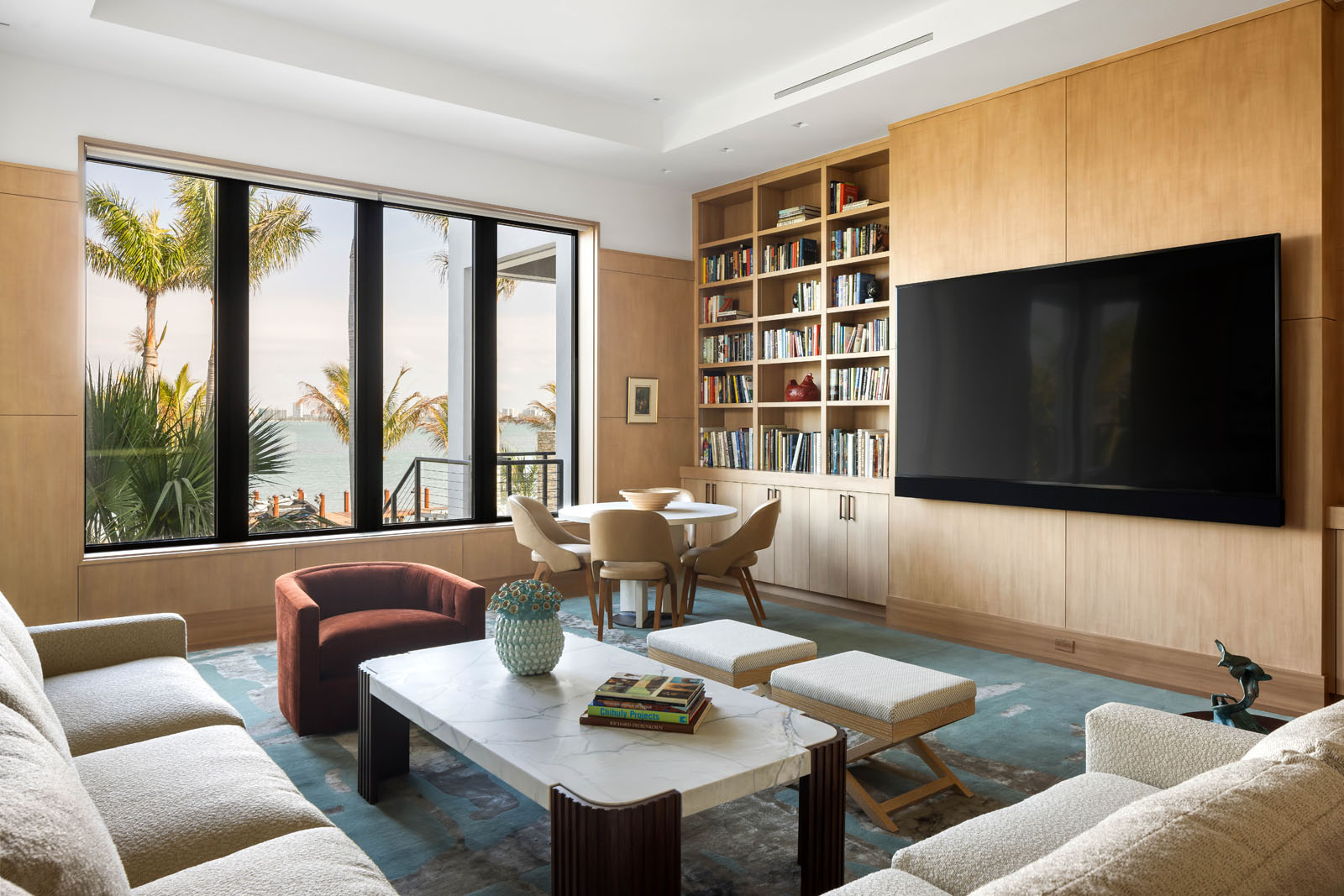 062_Norsota_Trinity_CMSA_RyanGammaPhotography_1 Family room with custom millwork wall and integrated media in coastal residence