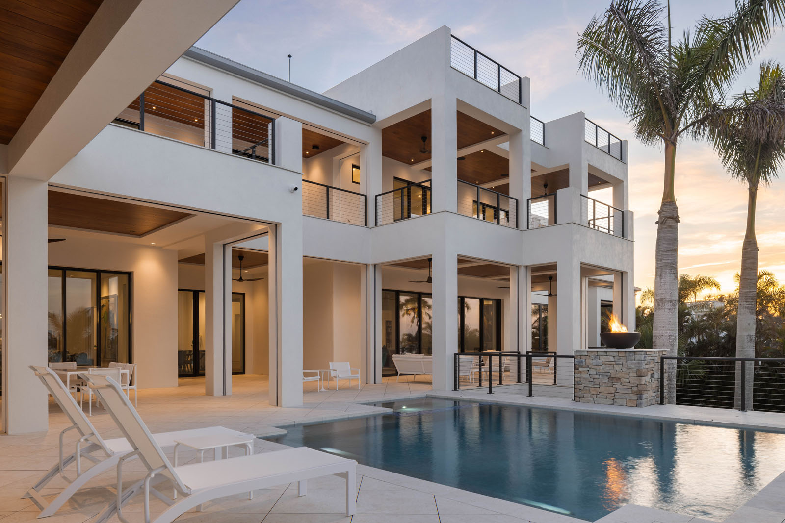 086_Norsota_Trinity_CMSA_RyanGammaPhotography (1)_1 Evening view of modern coastal home with illuminated outdoor living and pool